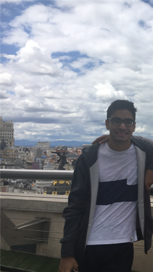 Rajit on a balcony overlooking the city 